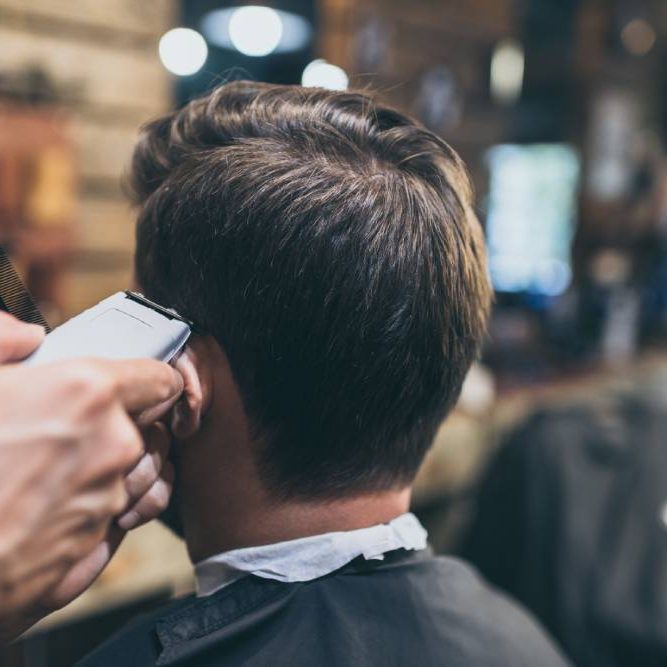 male-barber-cutting-hair-of-customer-in-barber-sho-2021-08-29-11-58-13-utc (1)